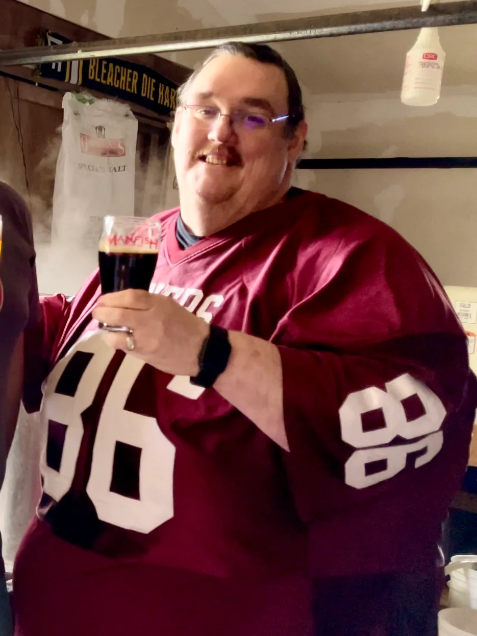 Ken in a red football jersey in 2020