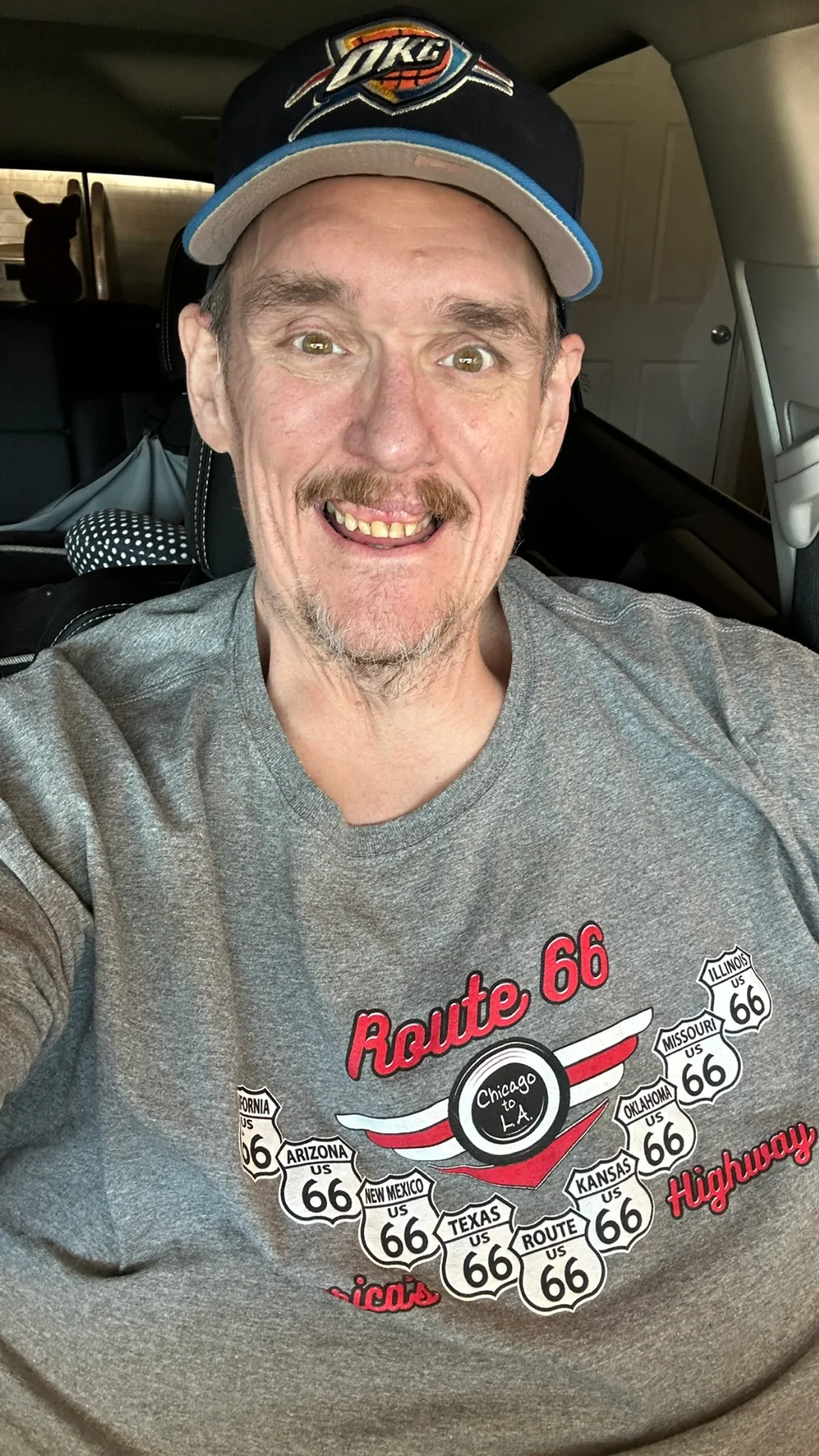Ken smiling in a Route 66 shirt and Oklahoma City cap, March 2026